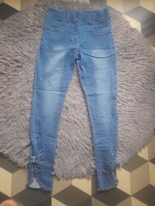 Nowe spodnie rurki z kokardkami roz M