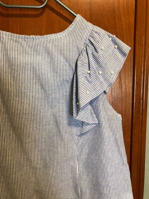 Blusa às riscas azul e branco