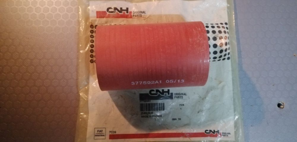Патрубок 87454331 CNH