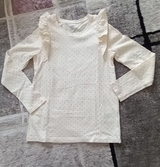 Ruffled blouse. Girl aged 7–8 years