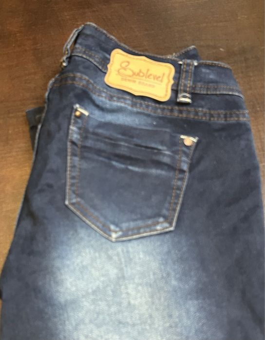 Spodnie jeans damskie XS niebieskie dżins przecierane