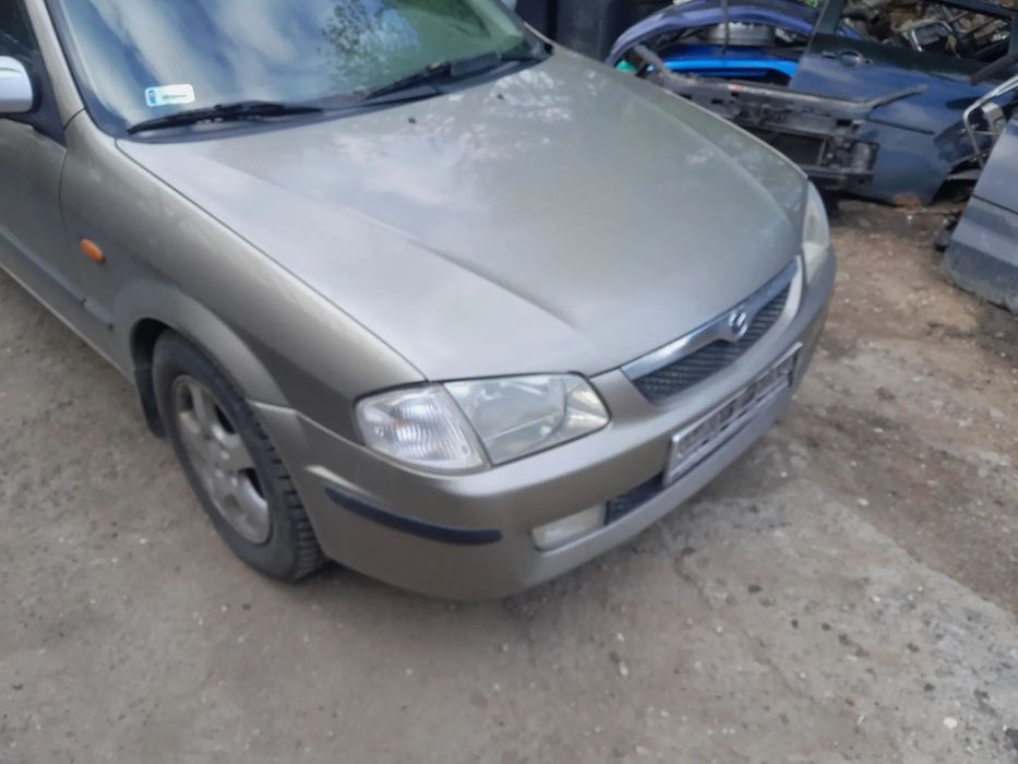 Mazda 323 323f BJ 98-03  Maska lampa zderzak pas atrapa 12M