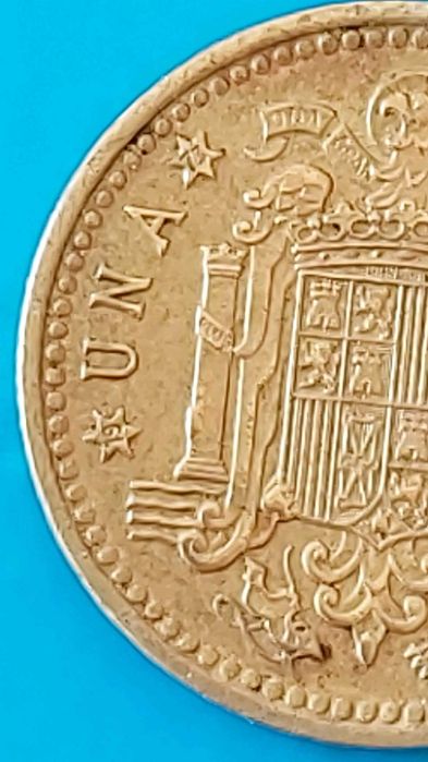 Una Peseta de 1966 com *73* na estrela, Espanha