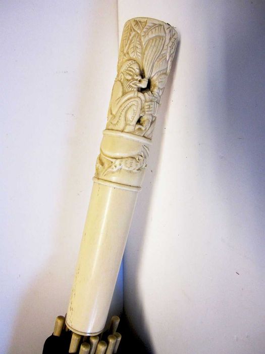 Antique Asian umbrella with precious carved handle