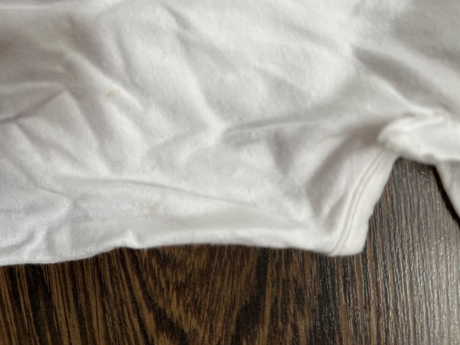 Biały t-shirt dziewczęcy bez rękawów r.92
