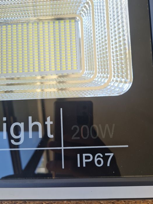 Holofote luz solar com sensor 200 led novo