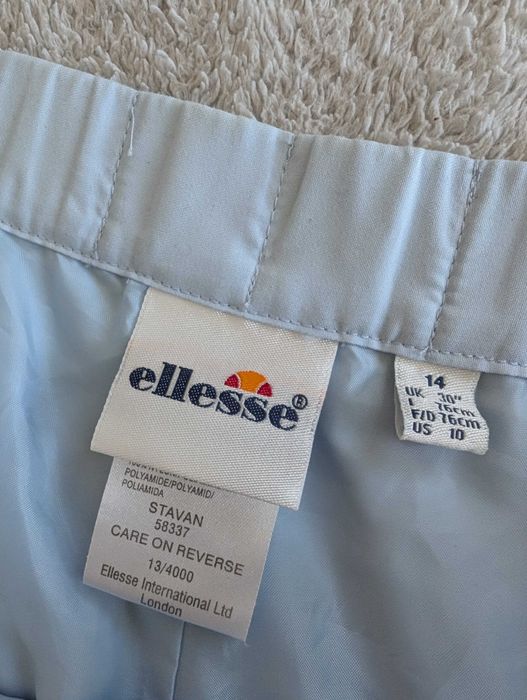 Niebieskie spodnie sportowe dresowe ortalionowe dresy Ellesse 38