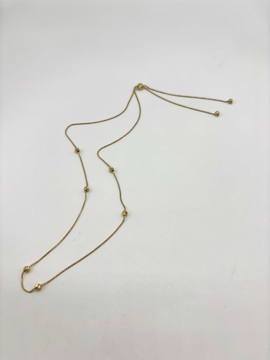 Złoty naszyjnik z kulkami rychomymi regulowany