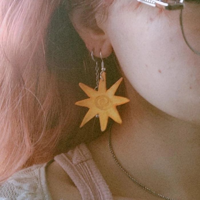 brincos estrela amarelos