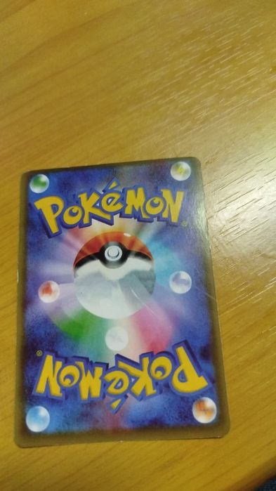 Carta de pokémon do charizerd VMAX