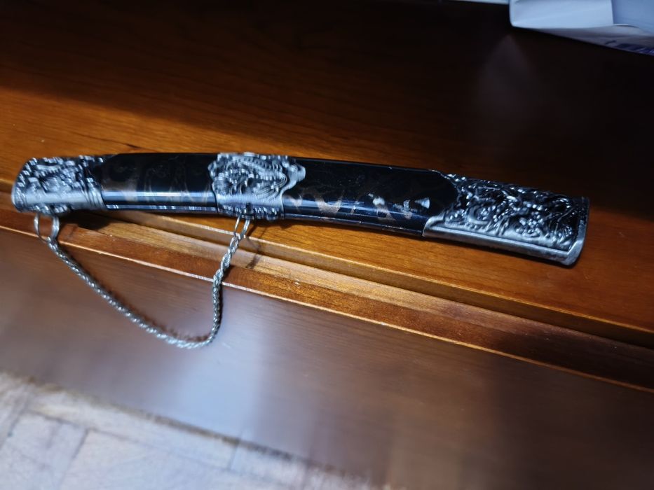 Vendo esta Espada elegância e beleza  para sua decoração