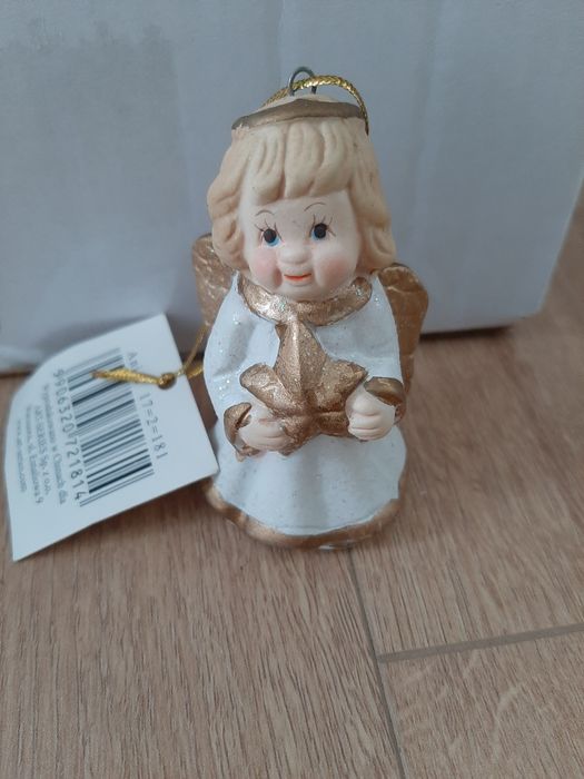 Nowy porcelanowy aniołek, biały anioł z gwiazdką