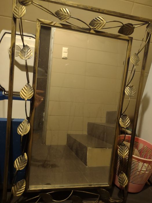 Lustro w kutej oprawie patyna