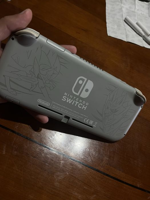 Nintendo Swich Lite+ Bolsa Oficial+5 jogos+ comando wireless pikachu