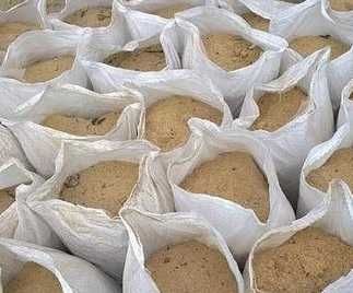 Цемент, пісок фасований, холодний асфальт, керамзит, щебінь в мішках