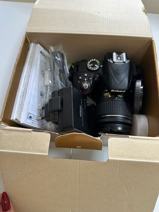 Máquina fotográfica nikon mais objetiva