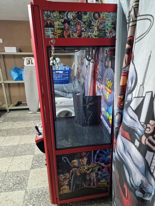 Máquina de brindes grua tema Toy Story Disney