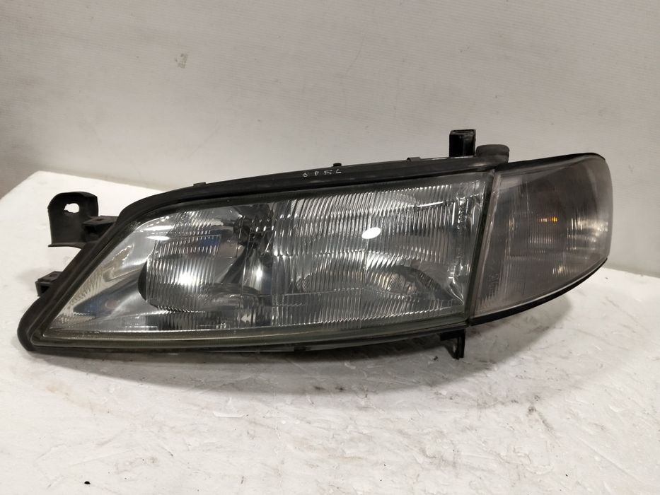 Farol Opel Vectra B ÓTICA esquerdo 1998
