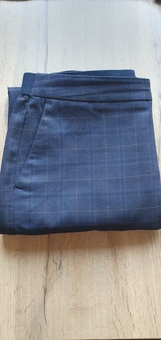 Eleganckie spodnie w kratę Reserved