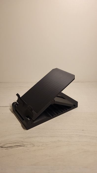 Підставка для телефона з регулюванням положення