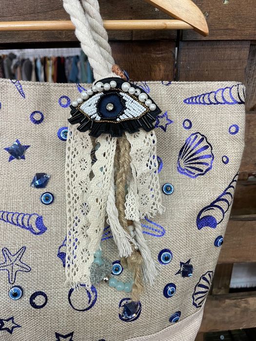 Bolsa rústica com bordado em Olho Grego
