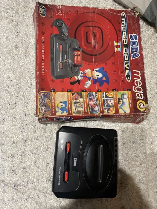 Mega drive ll com caixa original e comando/ ps2 com comando avariado e jogos