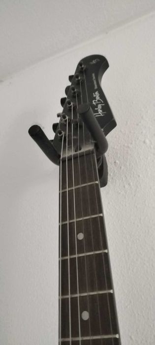 Apoio de parede para guitarra