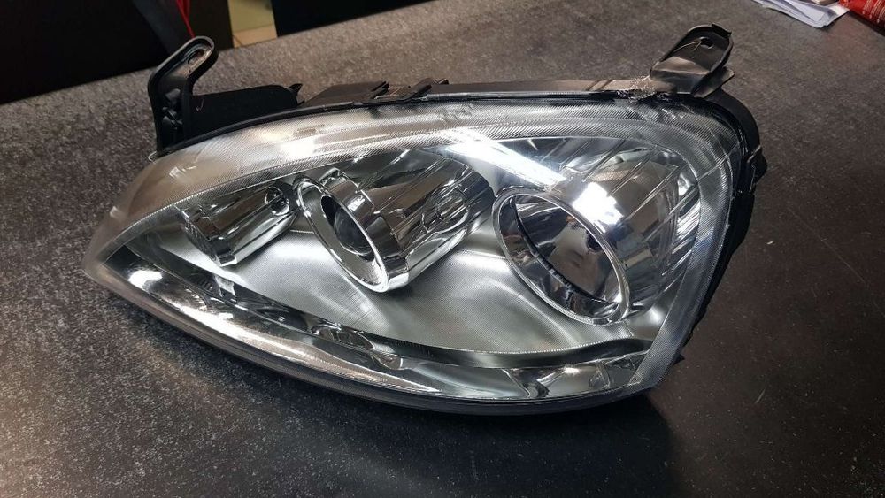 Reflektor Lewy  (H7, elektryczny, bez silnika, soczewka, OPEL COMBO C, CORSA C 06.03-10.10