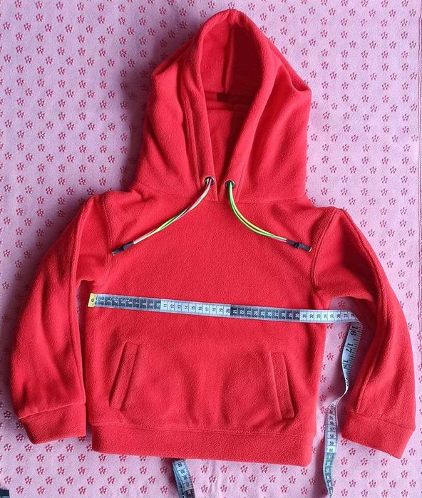 Unisex fleece jacket with a hood and a high collar. Very warm