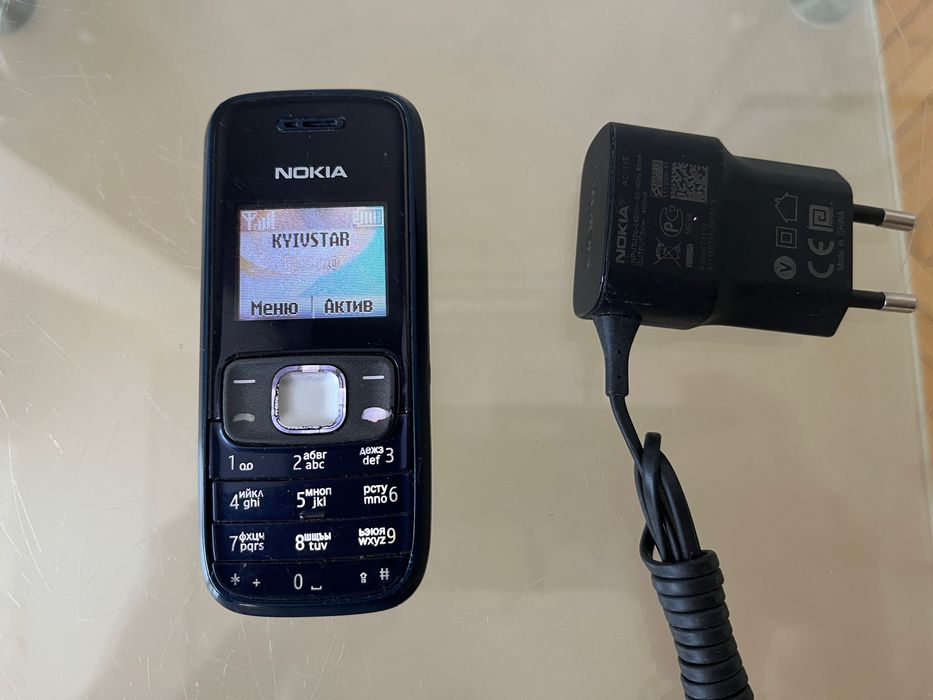 Мобильный телефон Nokia 1209 оригинальный (с зарядкой)