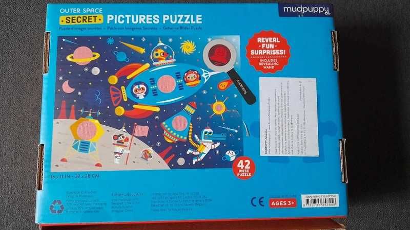 Puzzle kosmos z magiczną lupą.