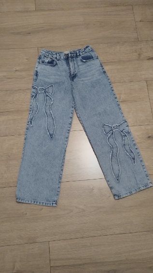 Jeansy  z kokardą rozm 158