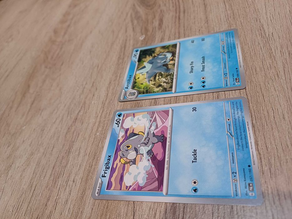 2 Pokémon Cards: Frigibax #57 and Arctibax #5964730017597569123
