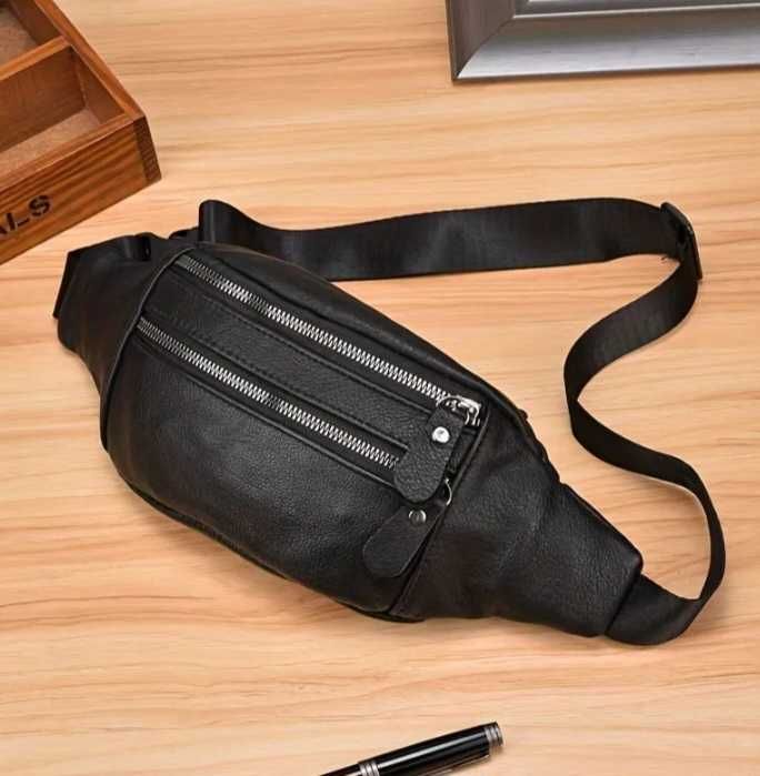 Фирменная кожаная сумка  на пояс,отличное качество.