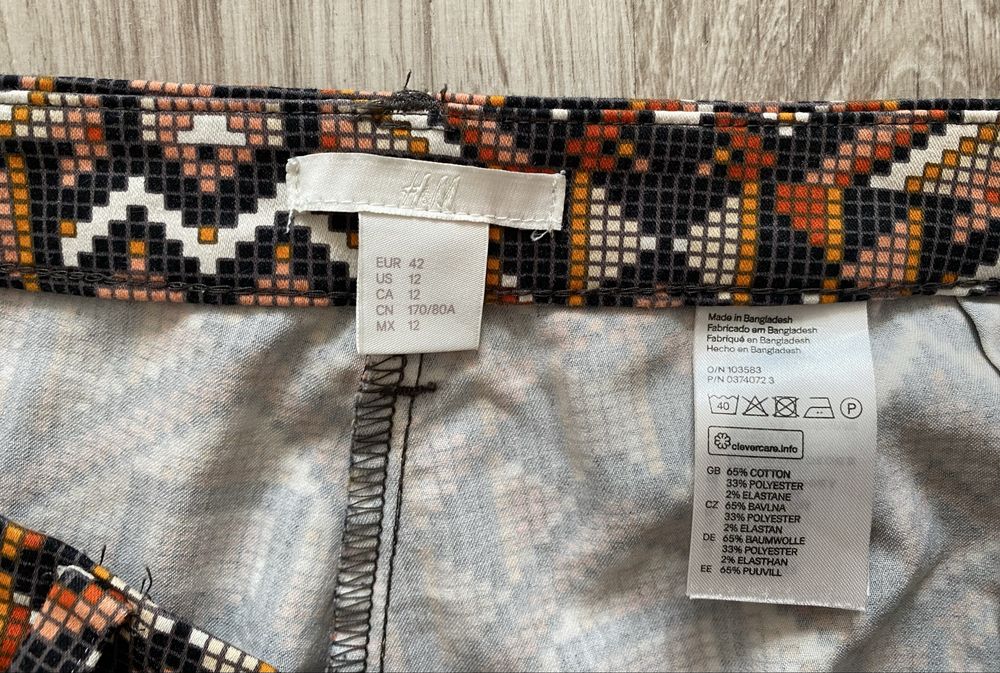 Wzorzyste spodnie H&M aztecki wzór brąz pomarańcz 42 xl jak nowe