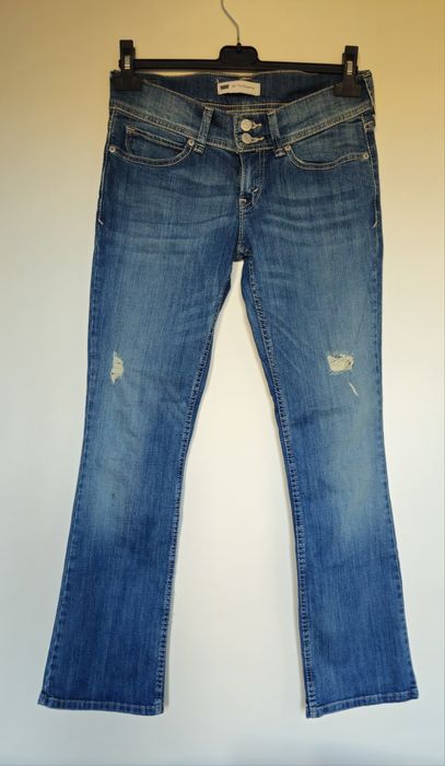 Levi's jeansy bootcut biodrówki przetarcia z USA