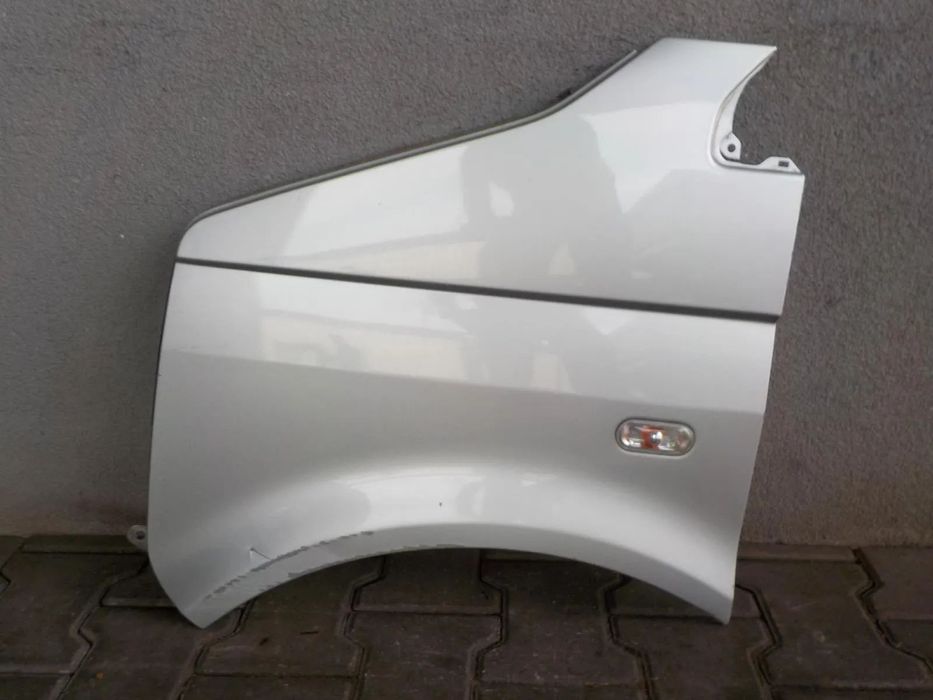 VW T5 BŁOTNIK LEWY PRZÓD ZDROWY LA7W