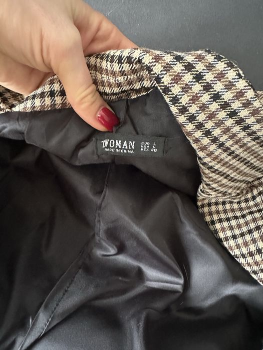 Жіночий піджак в клітинку
