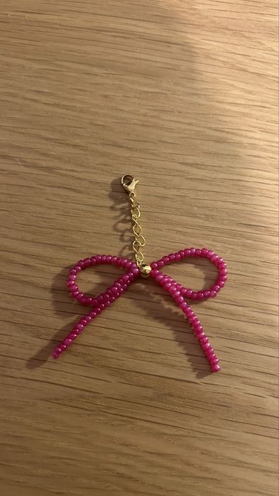 Pendente em formato Laço