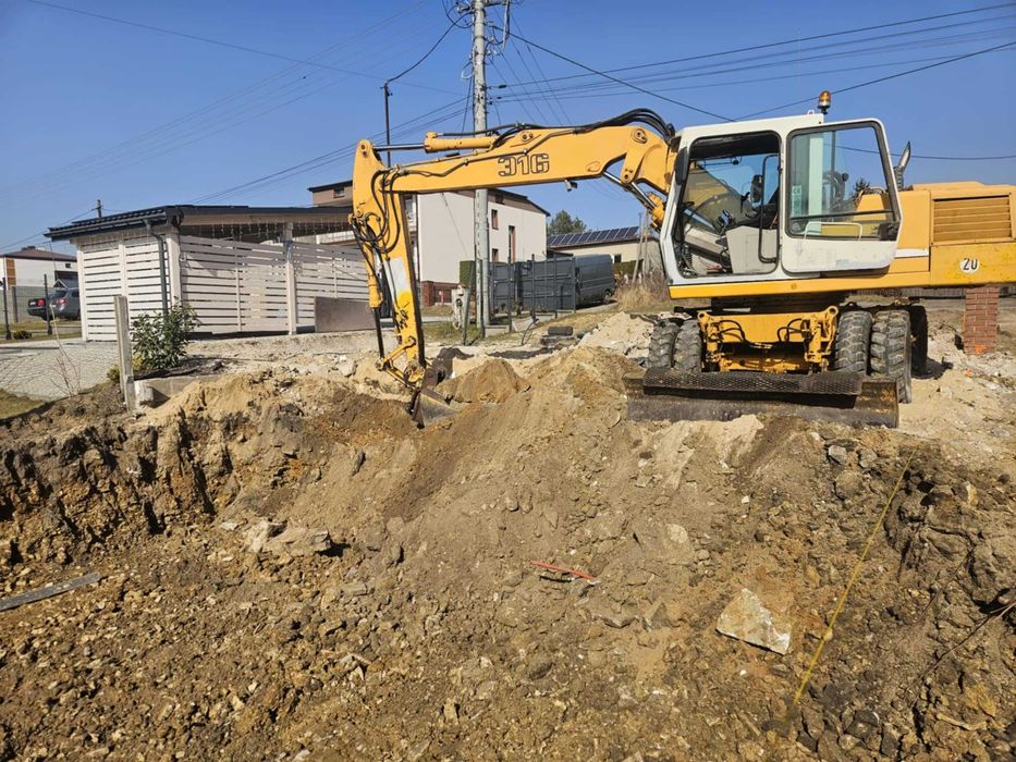 Wynajem usługi koparką kołowa wykop fundament równanie koparka