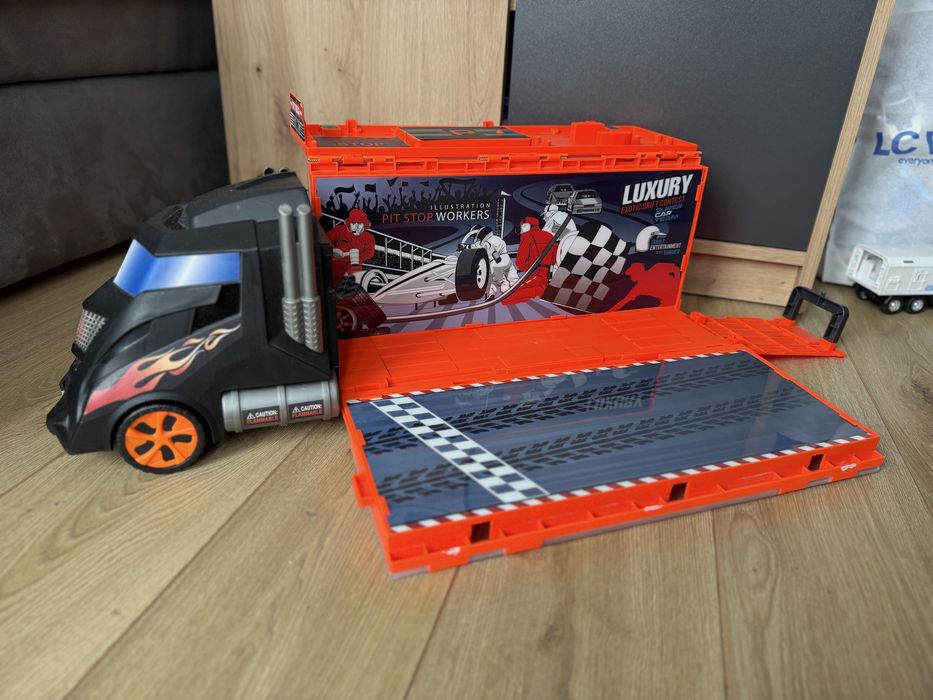 Автовоз і багато машинок