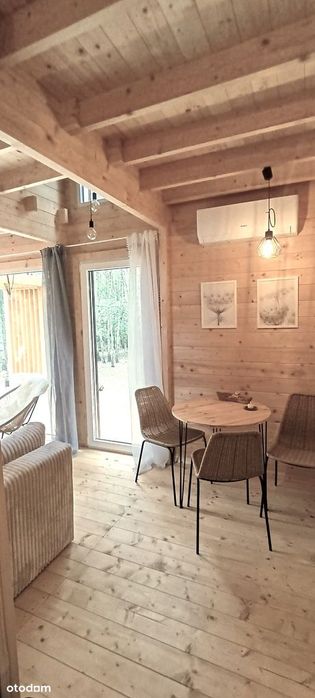 Dom drewniany całoroczny w lesie nad rzeką Wkrą