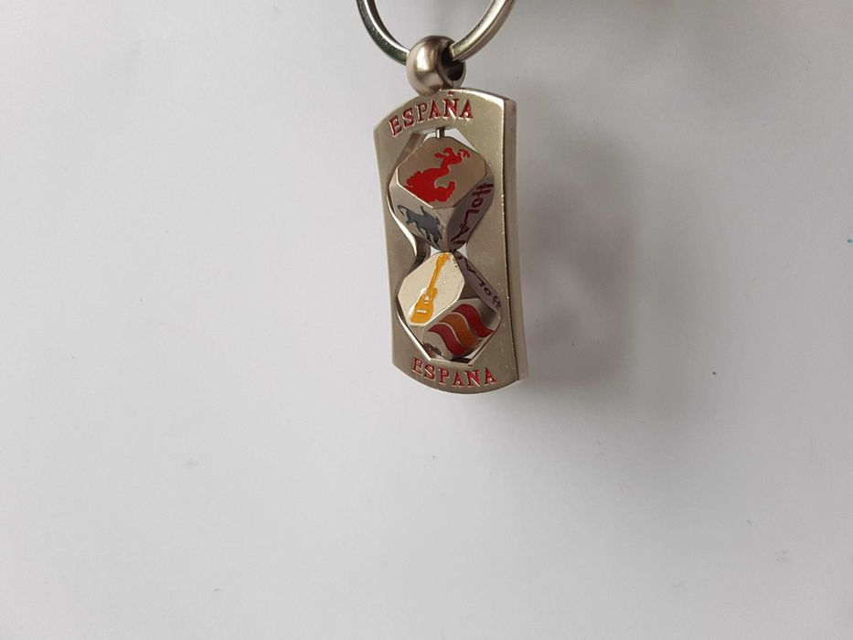 Красивий брелок з поворотними вставками, кубиками, espana