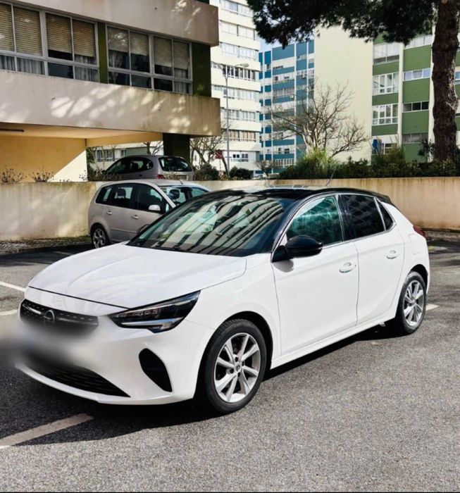 Opel Corsa - gasolina - mecânico - cor branca  com tecto preto