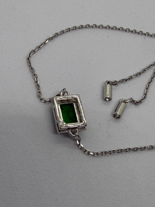 Bransoletka ściągana z zielonym oczkiem sygn Swarovski