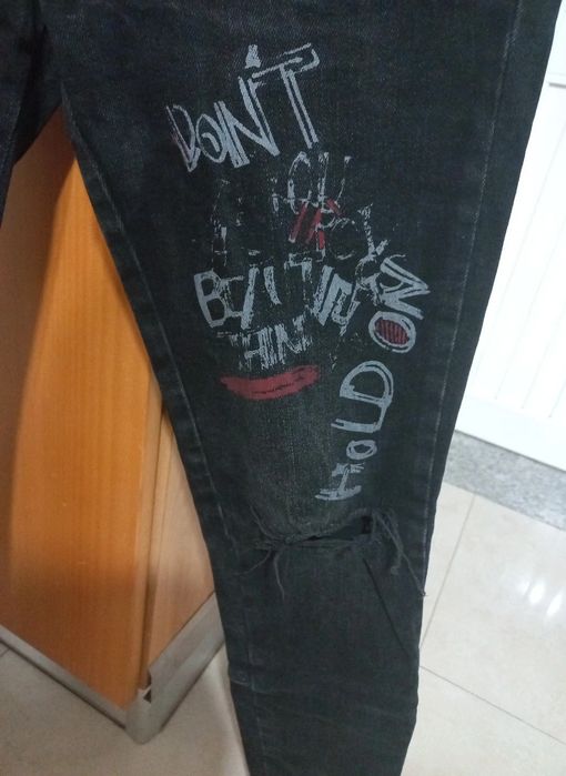 Calças de ganga rasgadas