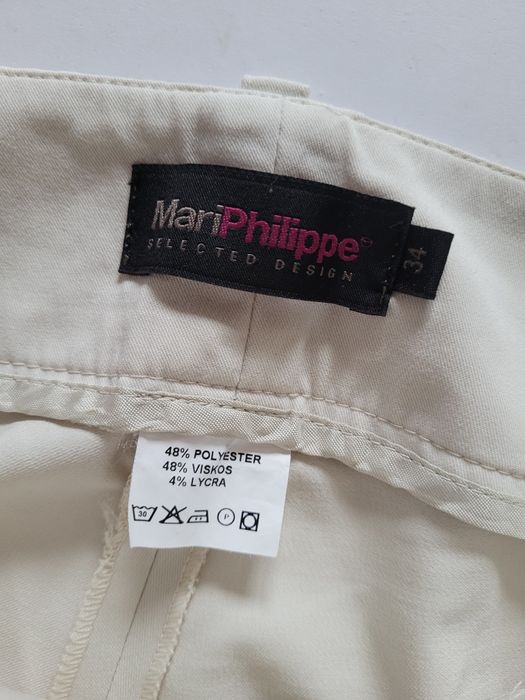 Kremowe spodnie dzwony flare bootcut niski stan biodrowki 34 XS