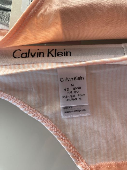 Majtki stringi Calvin Klein rozmiar  M 3 pak  
pomarańczowe