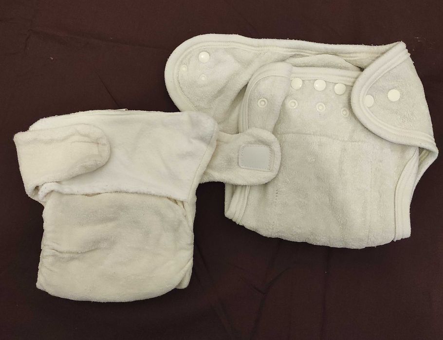 Fraldas de pano e impermeáveis que crescem com o seu bebê