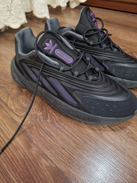 кросівки Adidas Ozelia у чорному кольорі, модель H04250. 
Дізнатися більше